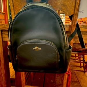 Almost new beautiful leather Coach backpack.   Used several times only.